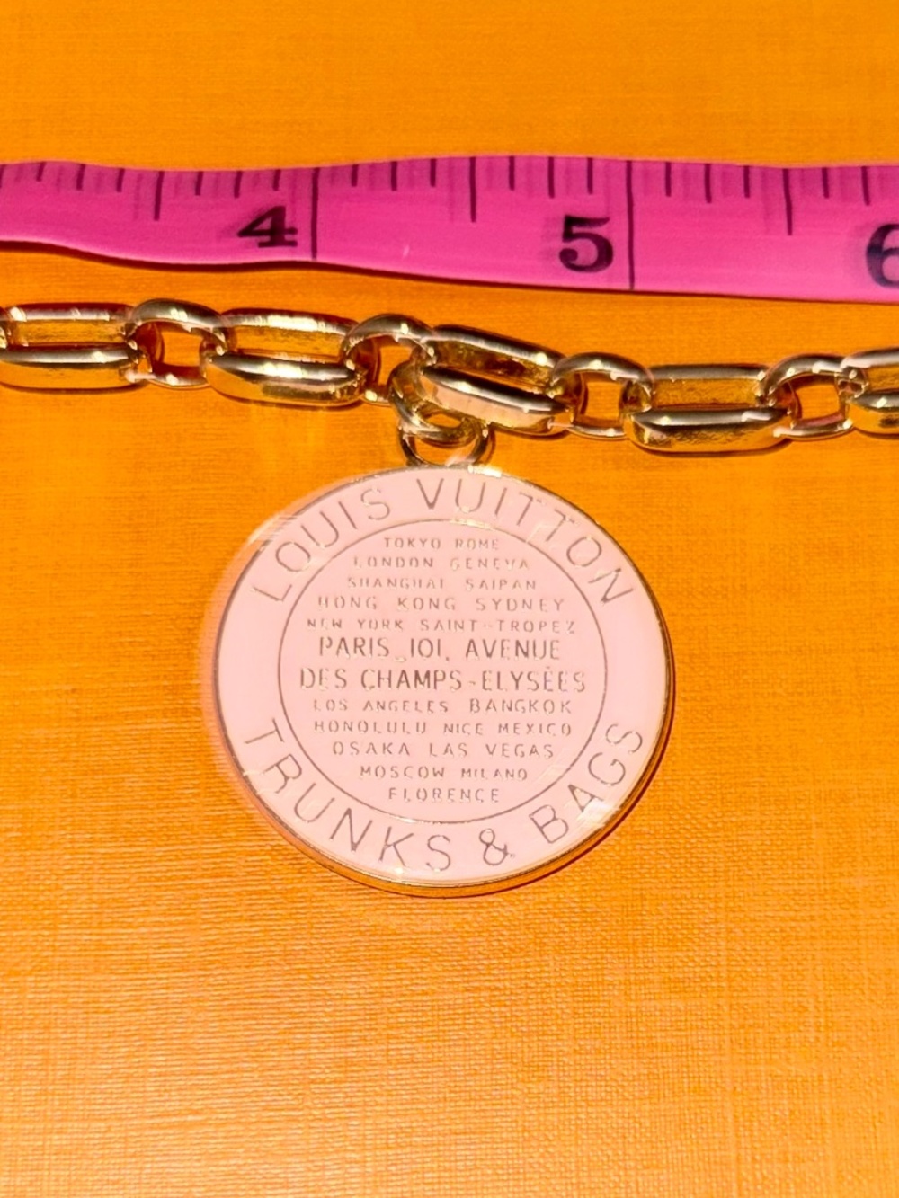 Authentic LV Luggage charm added to hypoallergenic bracelet